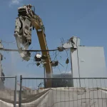 Heavy Machinery in Demolition of Building