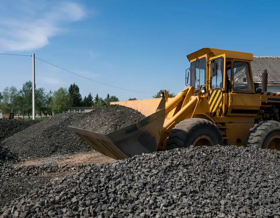 Bulldozer Moving Gravel at Construction Site