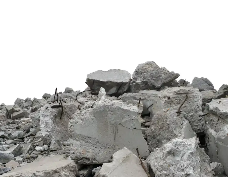 Pile of concrete rubble with exposed rebar from a building demolition.
