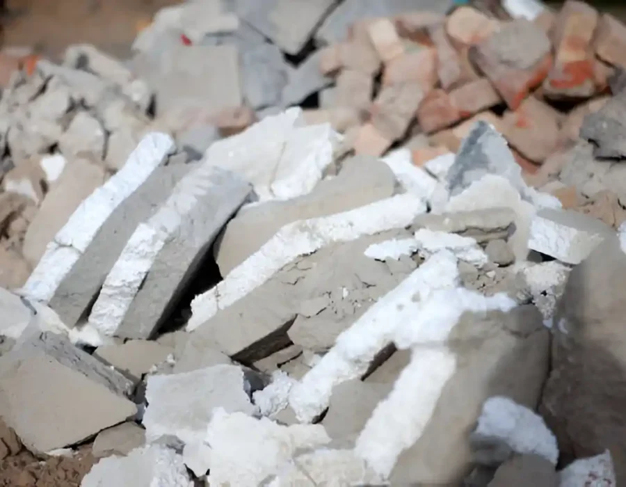 Close-up of demolished drywall, plaster, and gypsum board fragments from interior renovation site