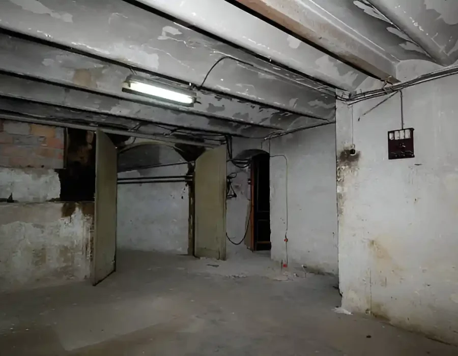 Old, deteriorated basement interior prepared for demolition and debris removal services.