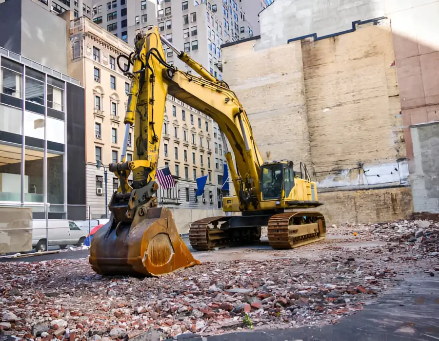 Excavator Clearing Debris on Urban Demolition Site