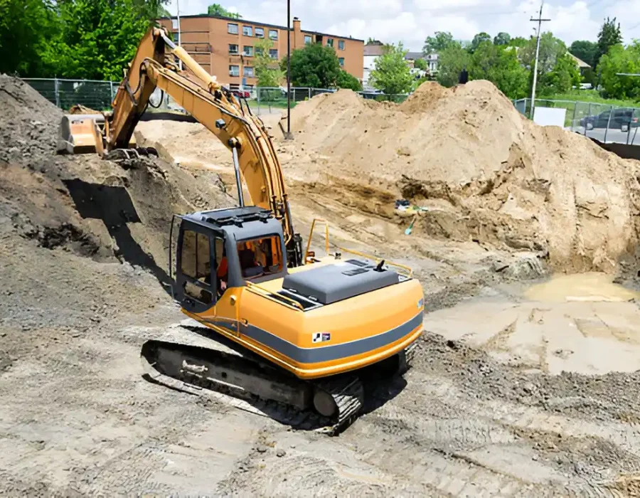 Excavator Working on Urban Site Preparation Project
