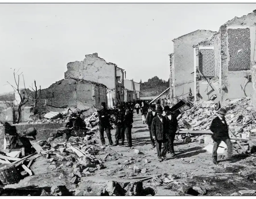Demolition Aftermath with People Amongst Building Debris