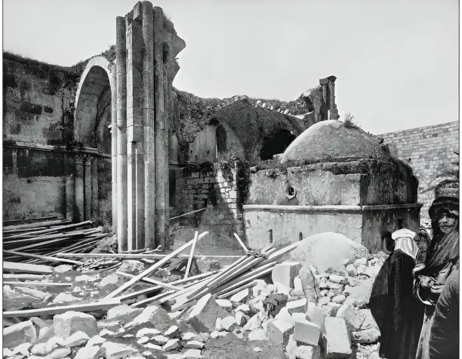 Ruins with scattered debris and collapsed stone structures in a historical site.