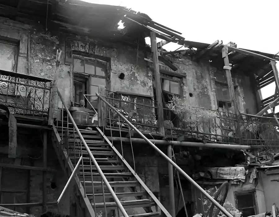 Old, deteriorated building with broken roof and stairs, ideal for demolition and cleanup services.