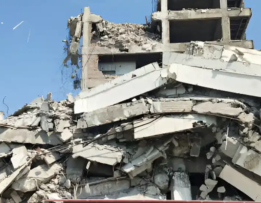 Collapsed Building with Heavy Debris After Demolition Process