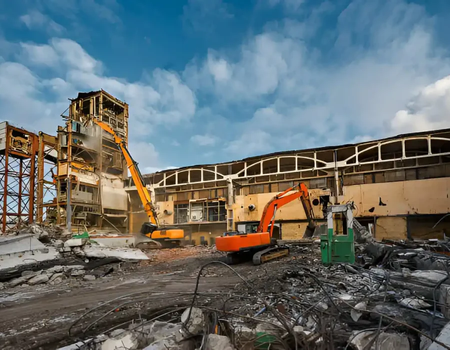Concrete Building Demolition Site with Rubble and Mobile Equipment Cleanup
