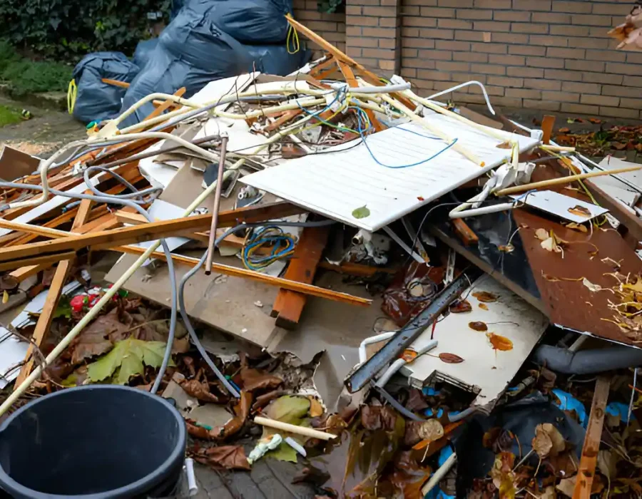 Pile of renovation waste including wood, metal and building materials ready for cleanup service