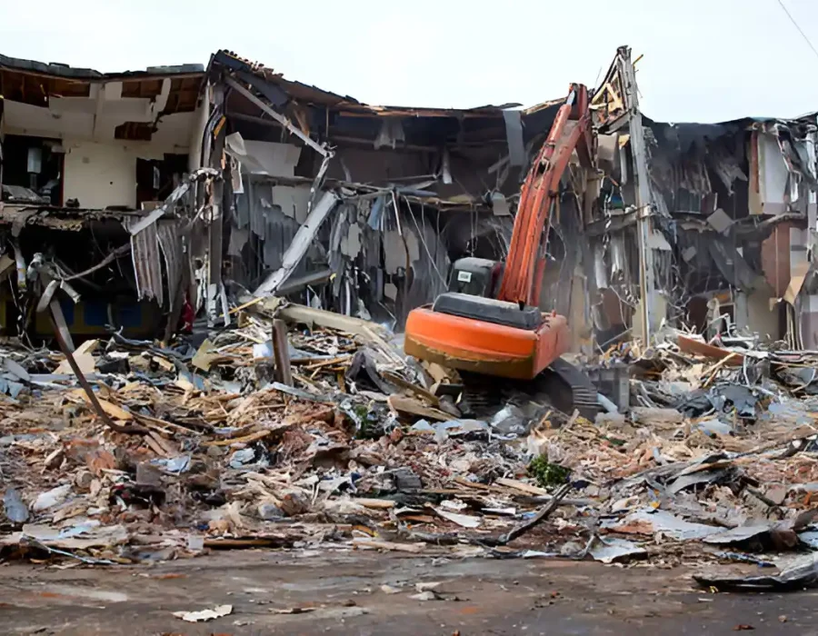 Excavator Demolishing Building Debris