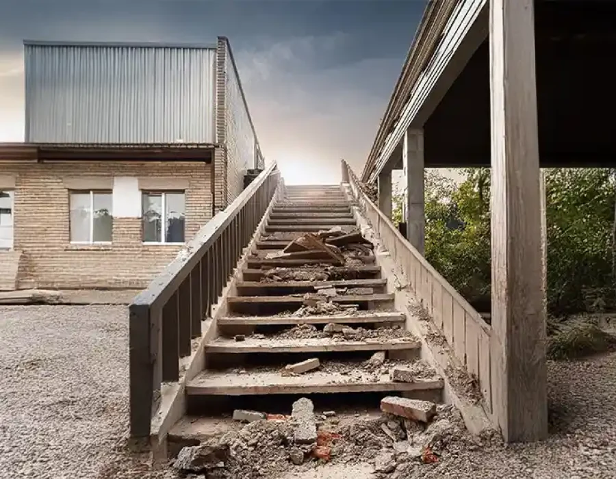 Deteriorated concrete staircase with debris and rubble requiring professional demolition and cleanup services