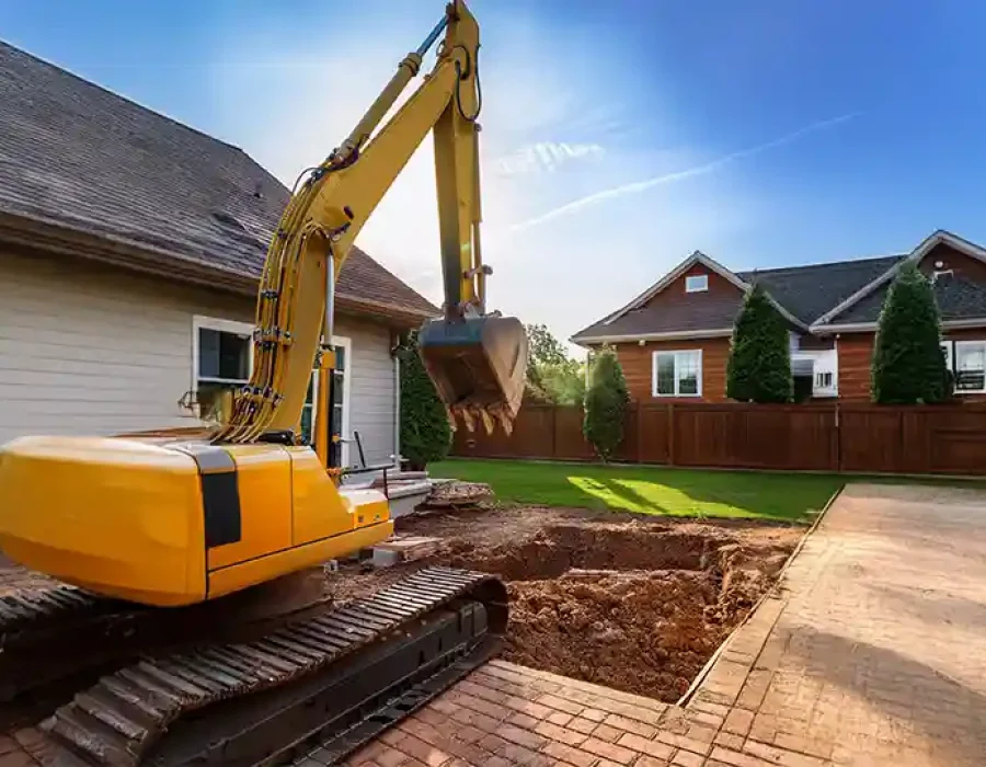 Heavy machinery clearing debris during demolition and site preparation work.