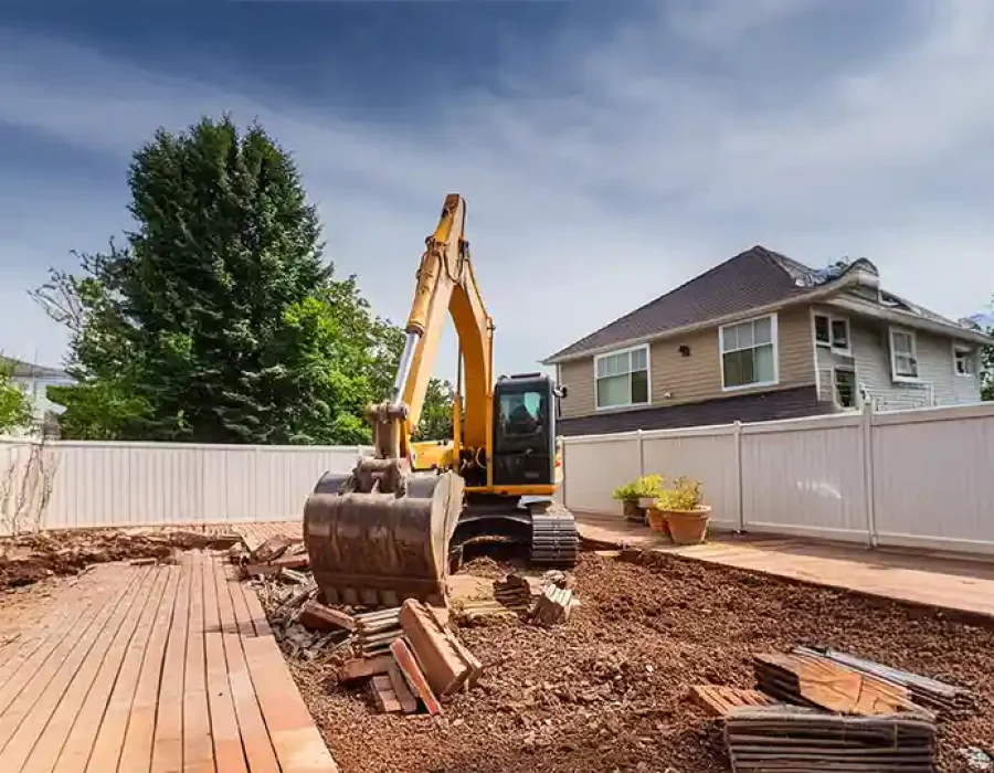 Heavy equipment clearing debris during professional demolition and cleanup work.