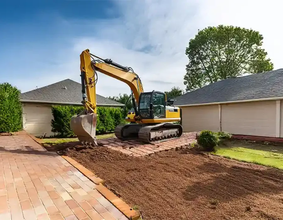 Heavy equipment performing demolition and debris removal at a construction site.