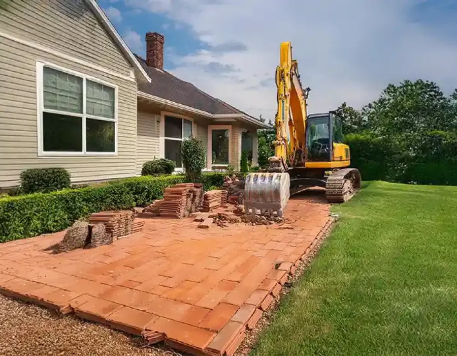 Heavy equipment clearing debris during professional demolition and cleanup work.