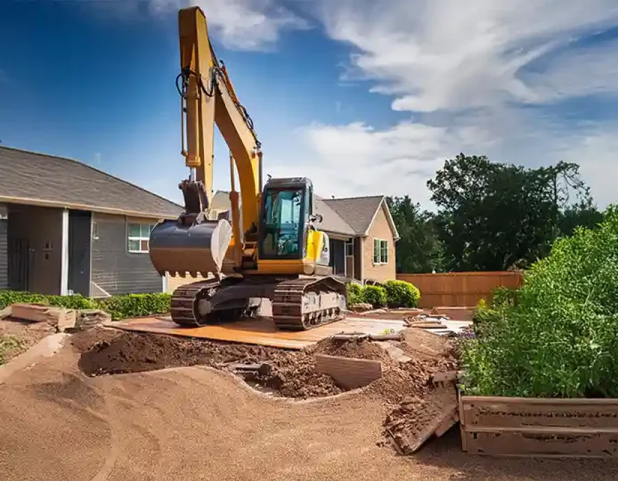 Heavy equipment performing demolition and debris removal at a construction site.