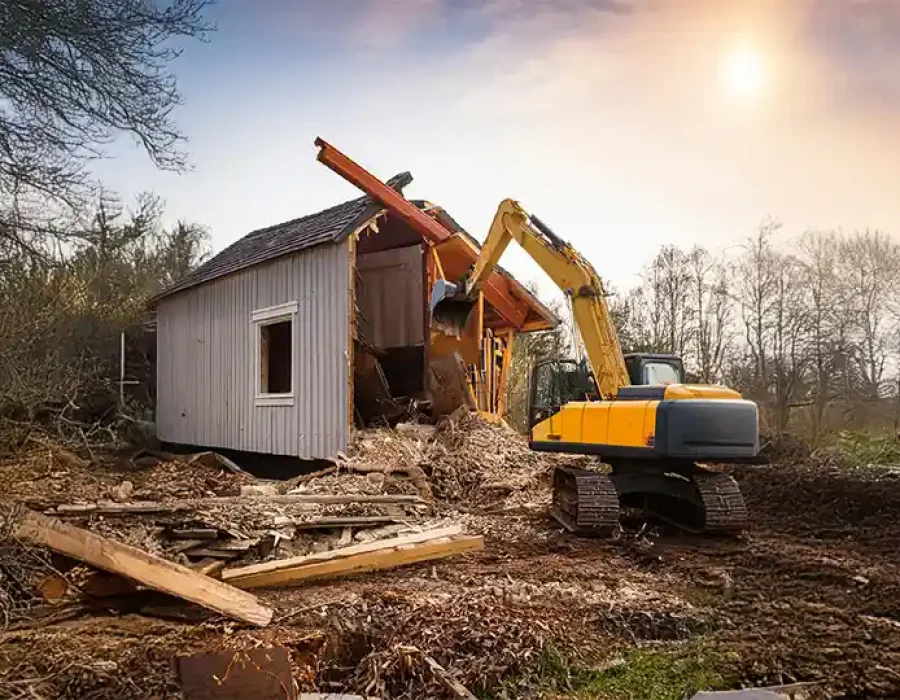 Heavy machinery and crew clearing demolition debris for efficient site cleanup and preparation.
