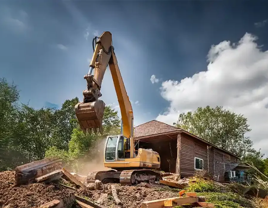 Skilled workers and machinery performing demolition and debris removal for efficient site preparation.